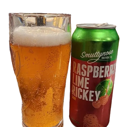 Pint glass filled with beer next to a can of Smuttynose Raspberry Lime Rickey on a white background