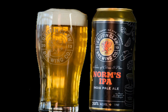 Griffin Claw Brewing Co. Norm's IPA can and glass with beer on a black background