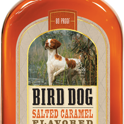 Bottle of Bird Dog Salted Caramel Flavored Whiskey with a dog illustration on the label.