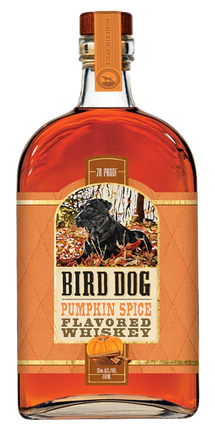 Bottle of Bird Dog Pumpkin Spice Flavored Whiskey with a label featuring a dog in a forest.